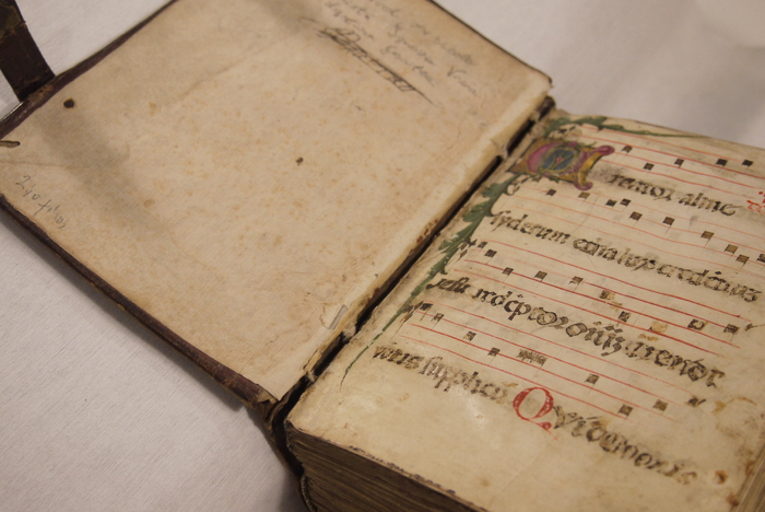 The inner spine of the Noted Hymnal is shown coming off the pages.