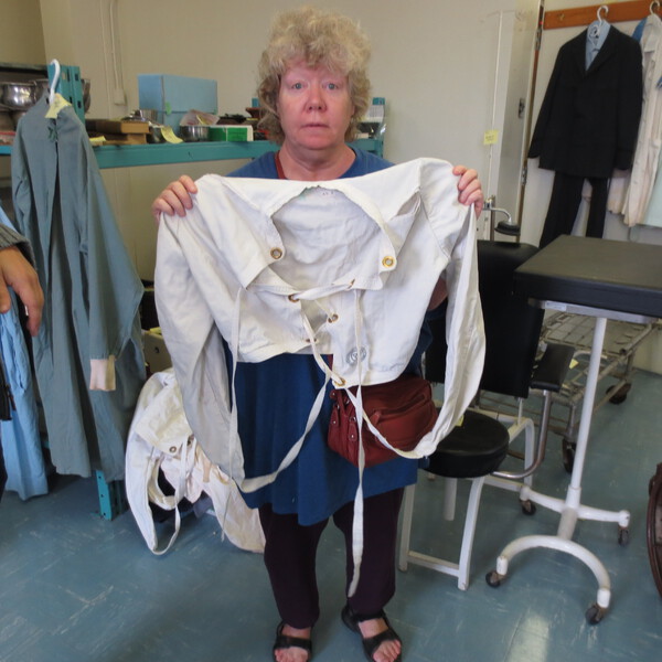 Patricia Seth Holds Straight Jacket